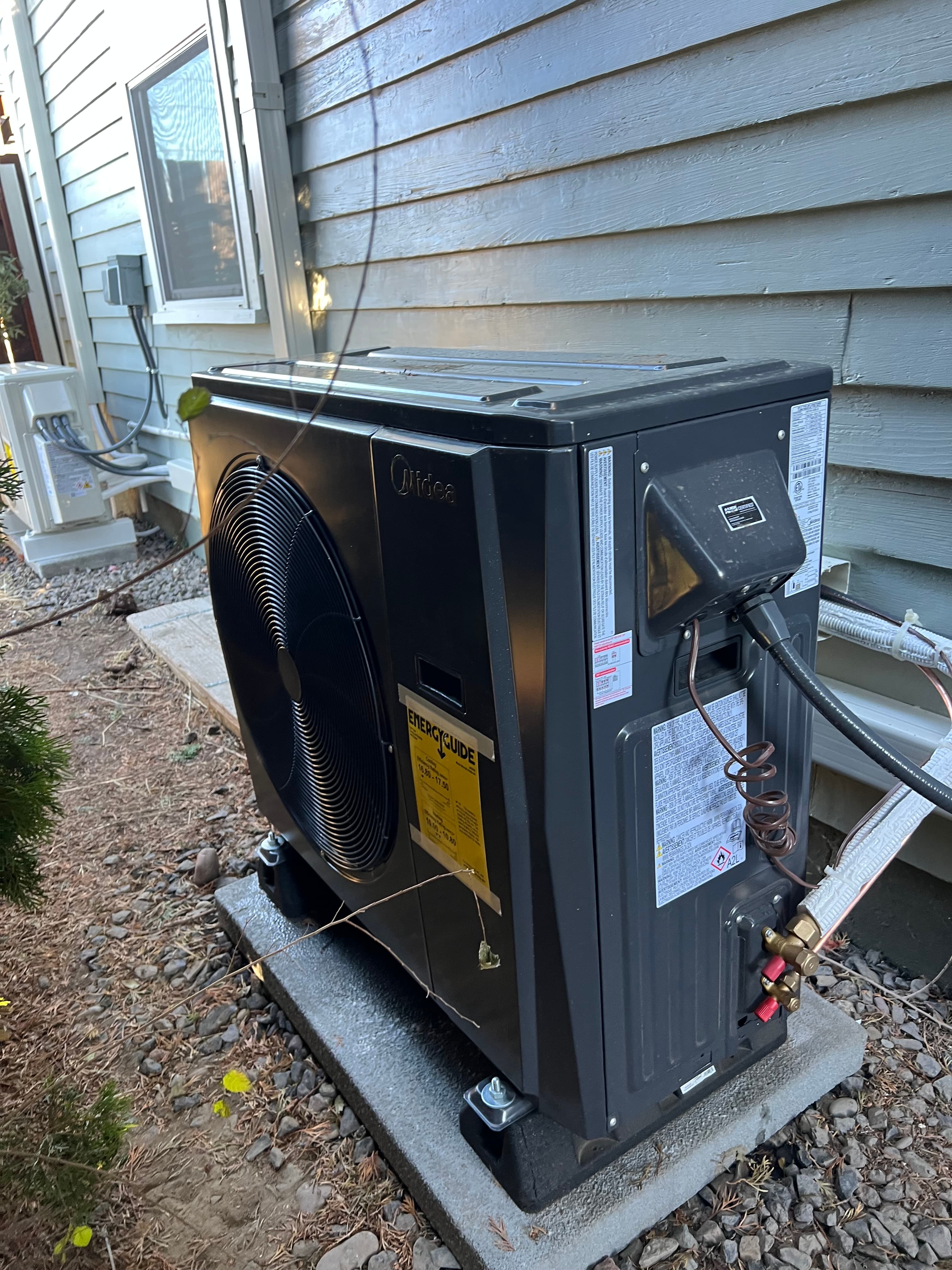 Outdoor heat pump installed by Aztec HVAC
